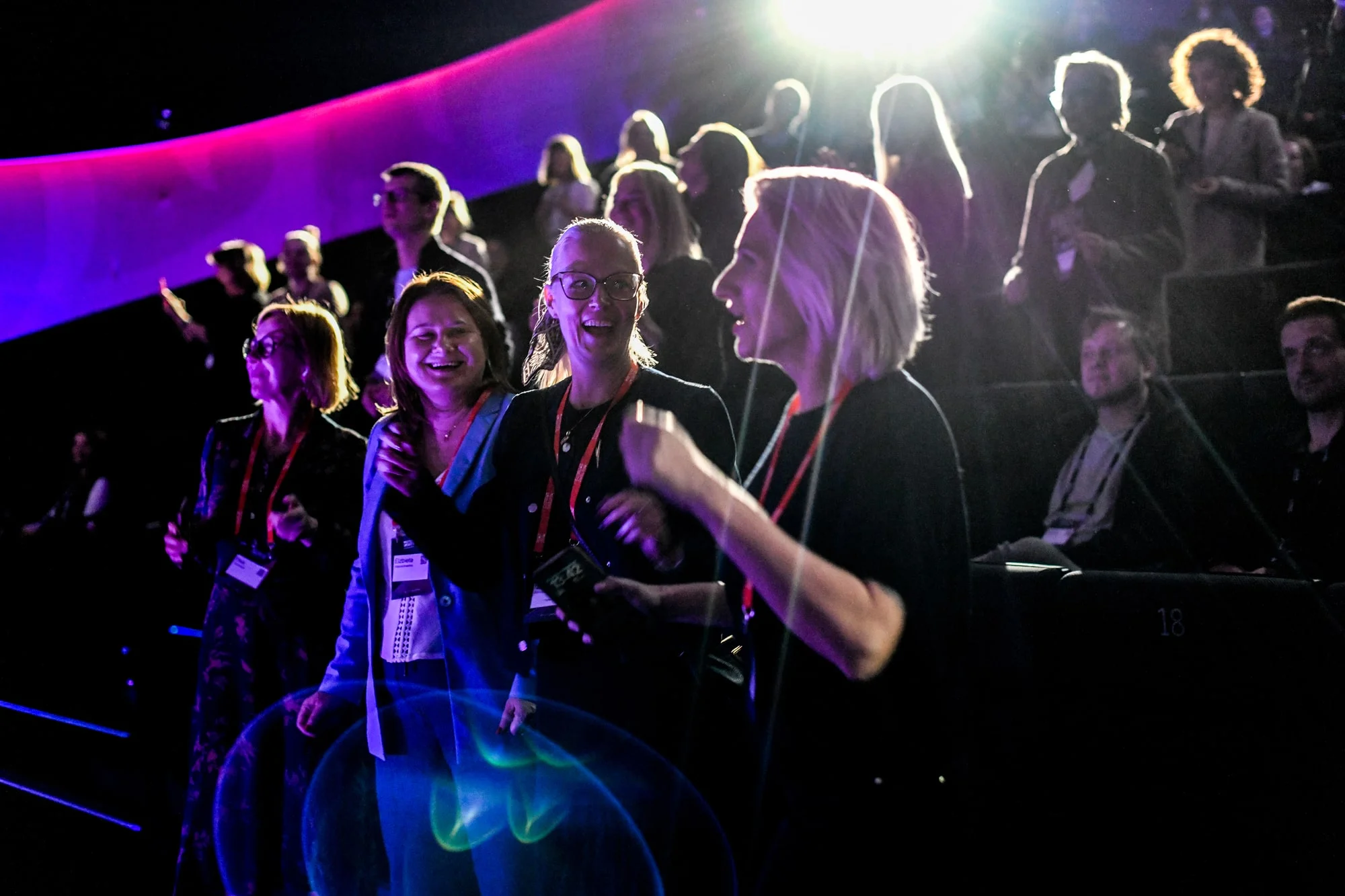 The Masters & Robots audience on its feet, laughing and dancing in the stage light during adj's live set